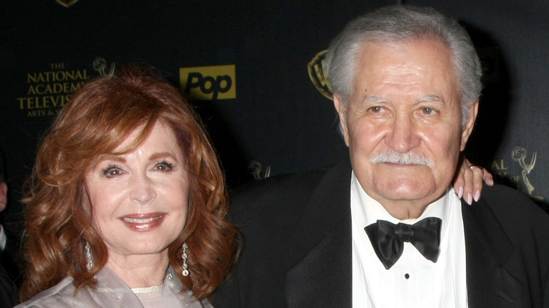 John Aniston and Suzanne Rogers pose on the red carpet. 