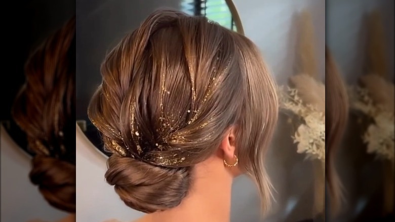 A gold braided bun