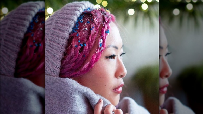 Person with colorful hair and hair glitter