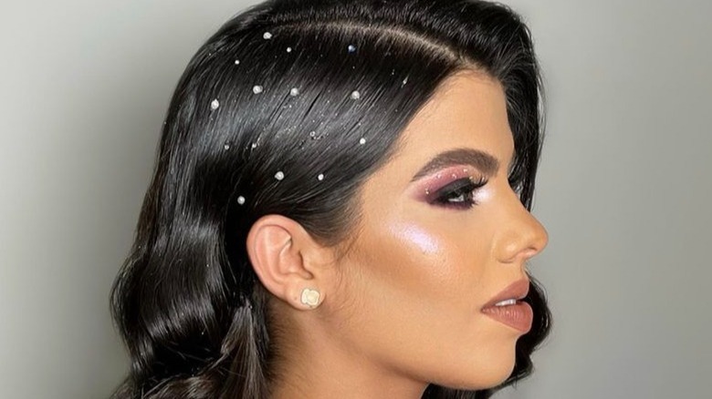 Person wit glittery side part