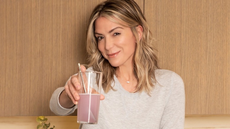 Debbie Matenopoulos holding a glass of water