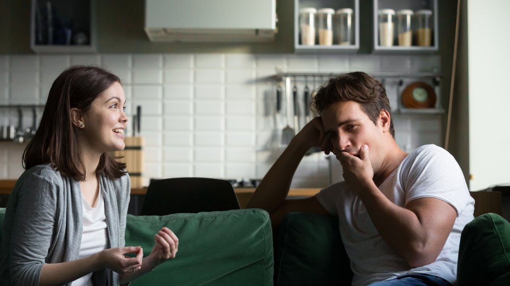 couple talking with one bored partner