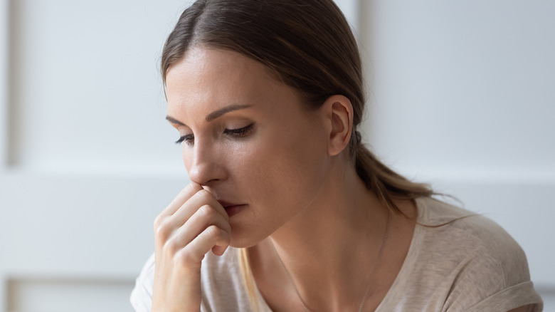 A woman looking sad and worried