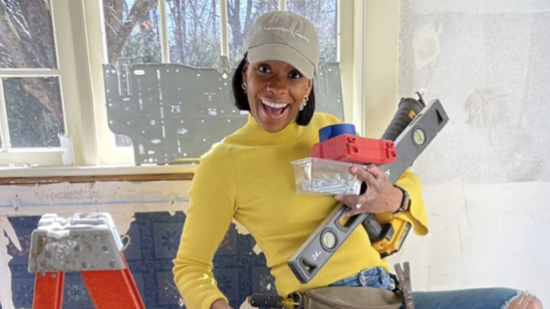 Denese Butler smiling with tools