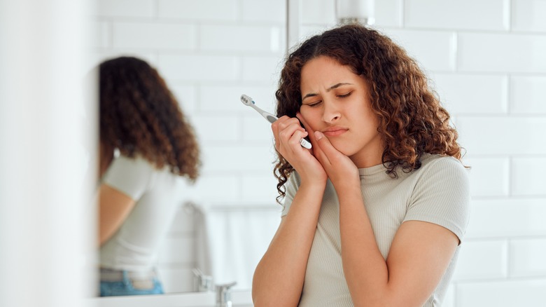 Woman experiencing tooth pain