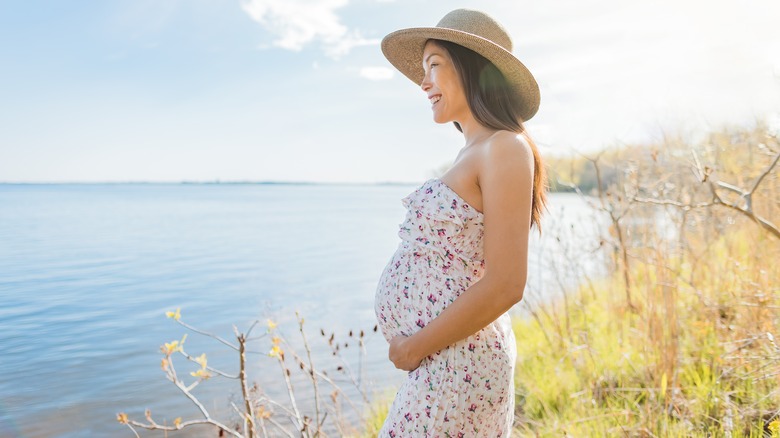 A pregnant woman enjoying the outdoors 