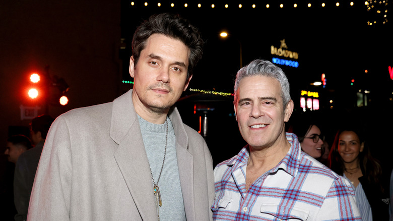 John Mayer and Andy Cohen smirking