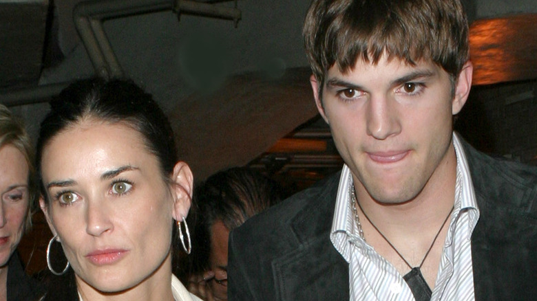 Ashton Kutcher and Demi Moore serious faces