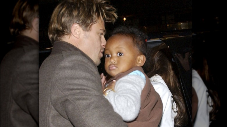 Brad Pitt carrying baby Zahara Jolie-Pitt