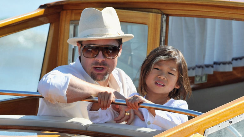 Brad Pitt on a boat with Pax Jolie-Piit