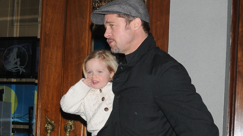 Brad Pitt holding toddler Shiloh Jolie-Pitt 