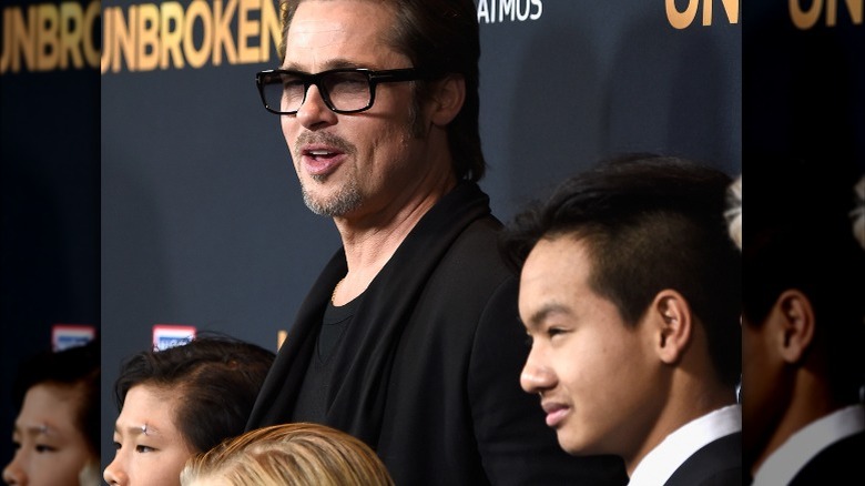 Brad Pitt walking the red carpet with Maddox