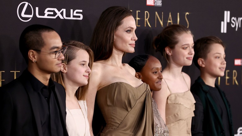 Angelina Jolie posing with five of her children 