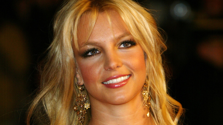 Britney Spears poses at the Palais des Festivals in Cannes, France (2004)