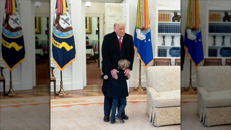 President Donald Trump is visited by grandson Theodore Kushner at the Oval Office