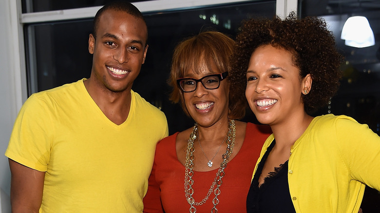 Gayle King, Kirby, and William Bumpus smiling