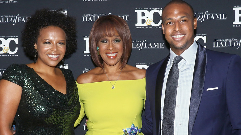 Gayle King, Kirby, and William Bumpus smiling