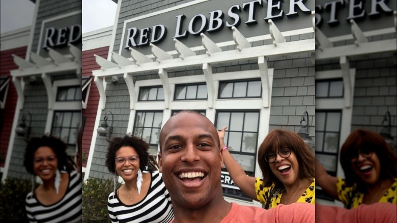 Gayle King, Kirby, and William Bumpus smiling