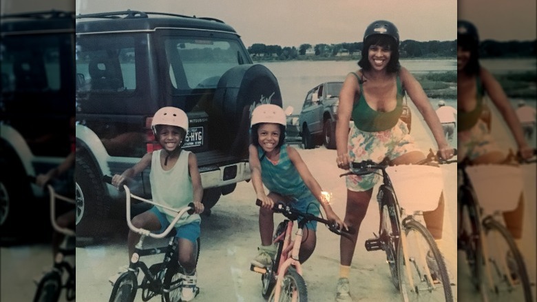 Gayle King, Kirby, and William Bumpus smiling