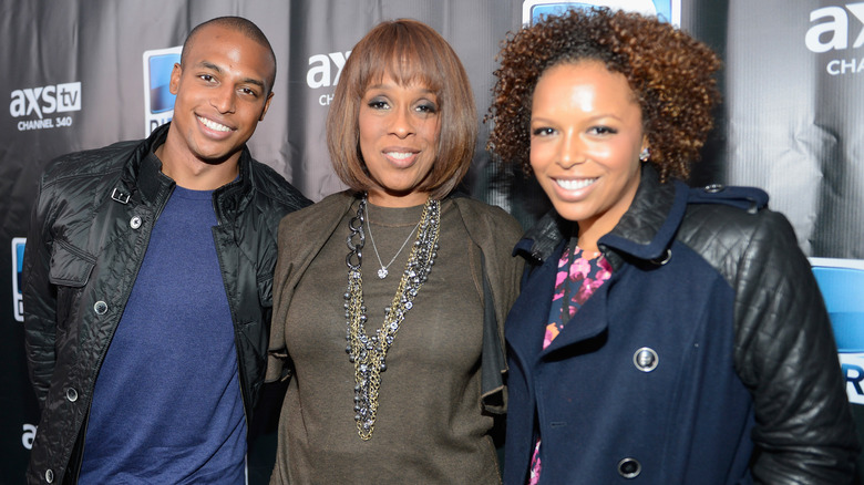 Gayle King, Kirby, and William Bumpus smiling