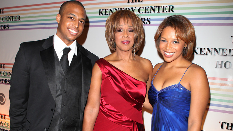 Gayle King, Kirby, and William Bumpus smiling