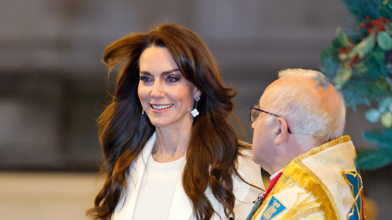 Kate Middleton smiling during Christmas event