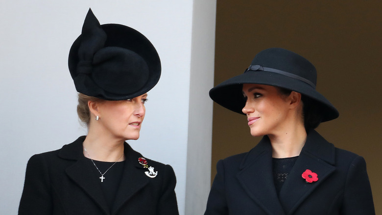 Sophie of Wessex and Meghan Markle looking at each other