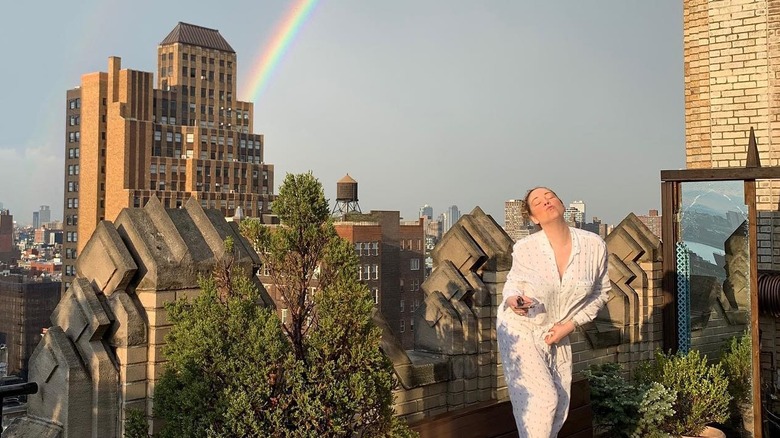 Mariah Carey posing on penthouse balcony