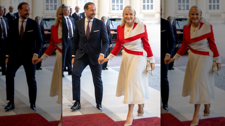 Prince Haakon and Princess Mette-Marit holding hands