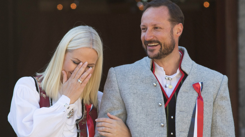 Princess Mette-Marit and Prince Haakon laughing