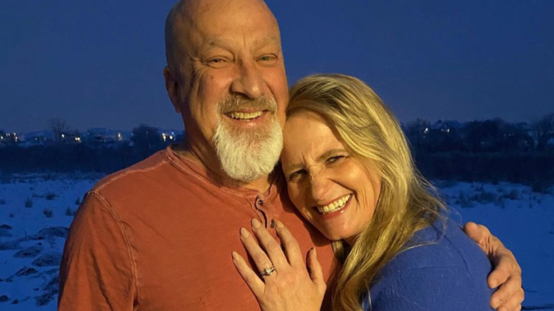 David Woolley and Christine Brown display her new engagement ring after getting engaged