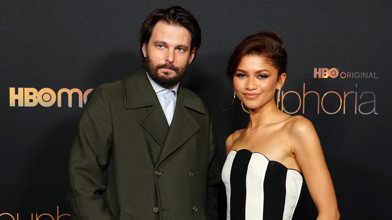 Zendaya and Sam Levinson posing for photos together