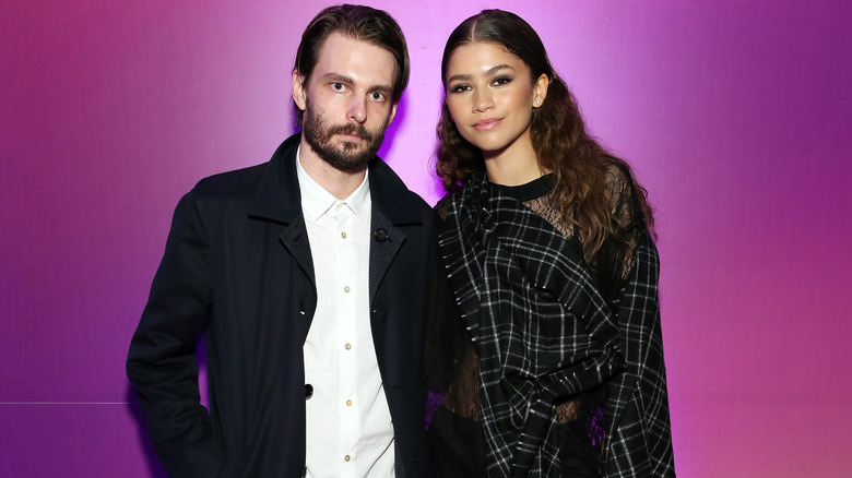 Zendaya posing for photos with Sam Levinson