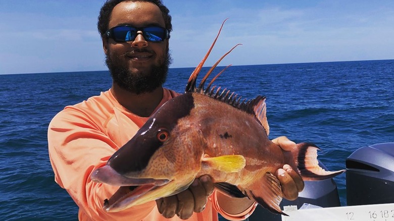 Connor Cruise holding a fish