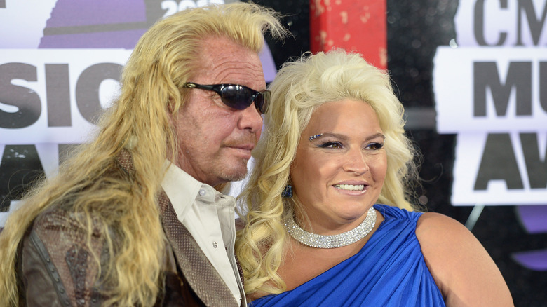 Dog the Bounty Hunter posing with wife Beth Chapman