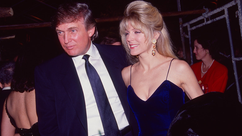 Donald Trump and Marla Maples posing at Joey Adams' 80th birthday party in New York, 1991.