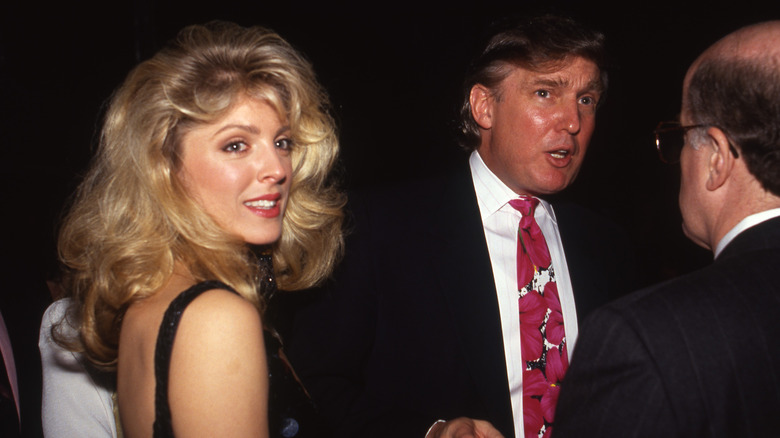 Marla Maples and Donald Trump talking at a boxing match in the '90s at the Trump Plaza Hotel and Casino.