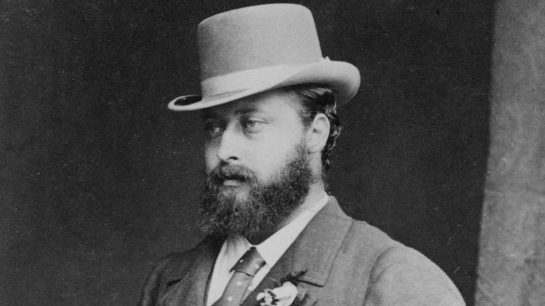 Prince Edward posing in a top hat and suit 