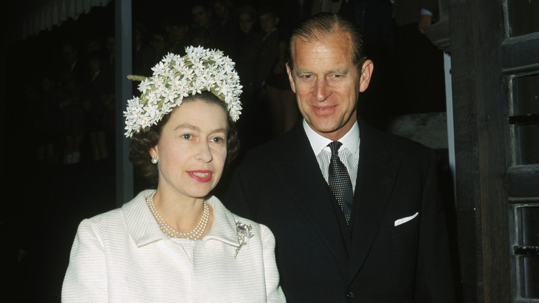 Queen Elizabeth II smiling with Prince Philip 