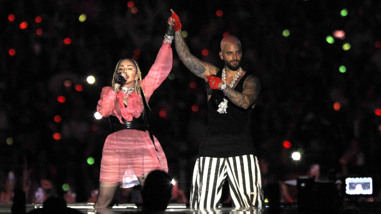 Maluma and Madonna performing at a concert