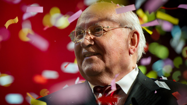 Mikhail Gorbachev surrounded by confetti