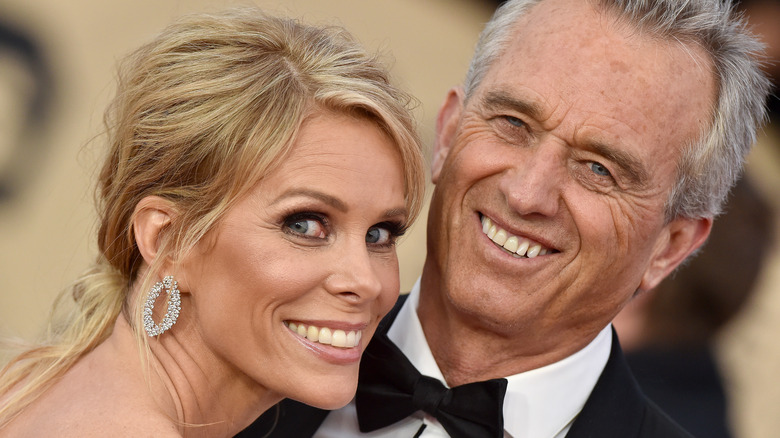 Cheryl Hines smiling with husband Robert F. Kennedy Jr.