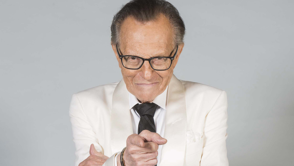 Larry King points at camera