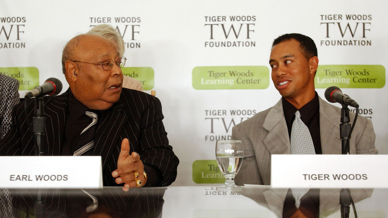 Earl and Tiger Woods at press conference