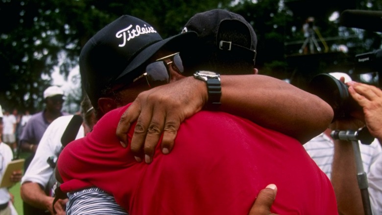 Earl Woods & Tiger Woods hugging