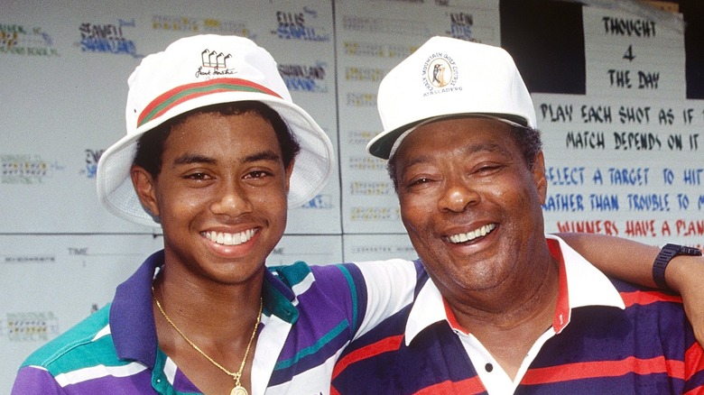 Tiger Woods & Earl Woods smiling