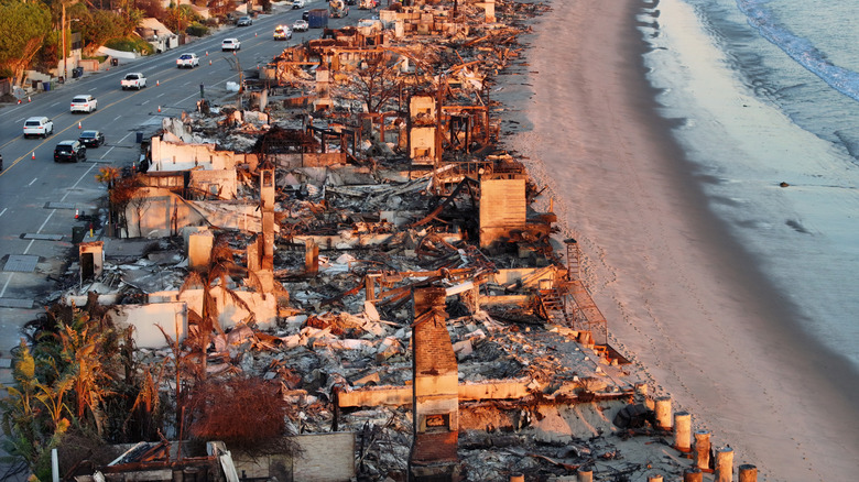 An aerial view of Malibu along the beach, showing homes that have burned down.