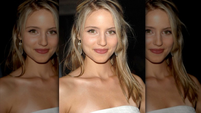 Dianna Agron posing for a picture at an event 