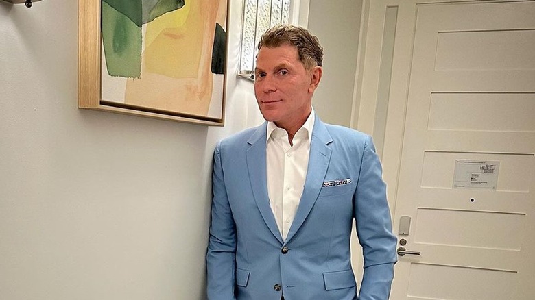 bobby Flay posing in hallway