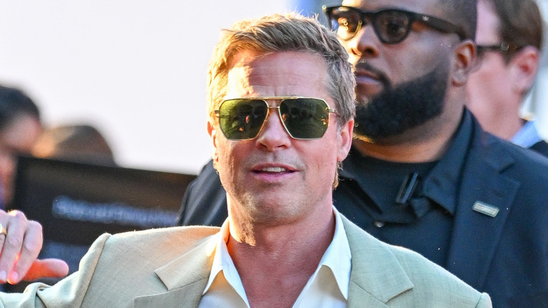 Brad Pitt smiling in sunglasses